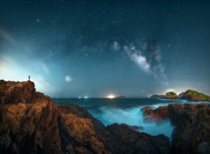 the Milky Way galaxy shining brightly in the night sky. Countless stars twinkle against a backdrop of darkness, creating a stunning visual display that evokes a sense of wonder and amazement.